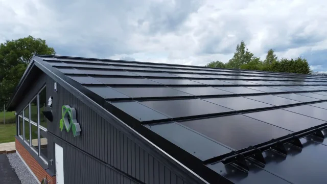 Full-roof integrated solar installation on a building in Sweden.
