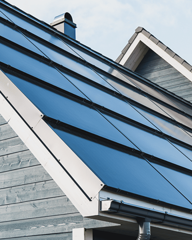 Clean roof design with integrated solar panels. Solarstone.