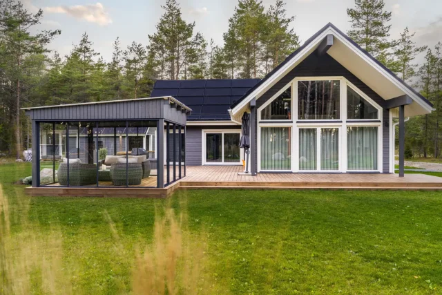 Modern wooden home with an integrated solar roof in Muhu, Estonia.
