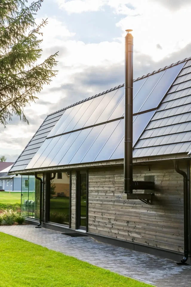 Integrated solar roof with a seamless transition to traditional roof tiles.