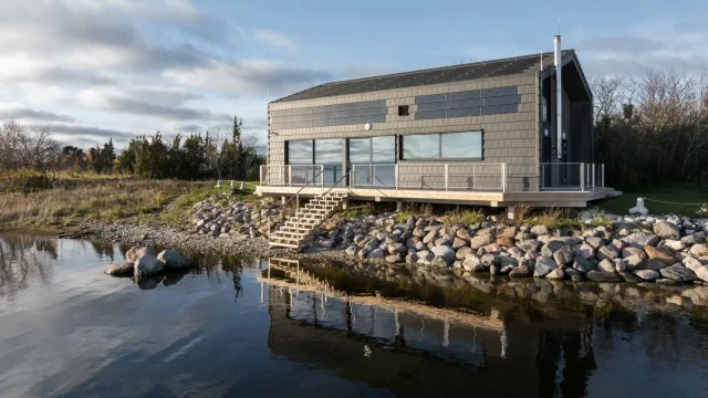 Waterfront Maritime Institute building with photovoltaic panels integrated into the upper façade.