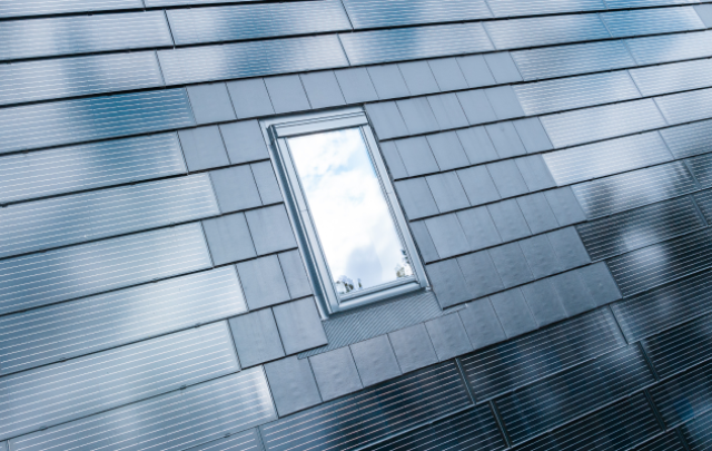 Solar tiled roof with integrated skylight. Solarstone.