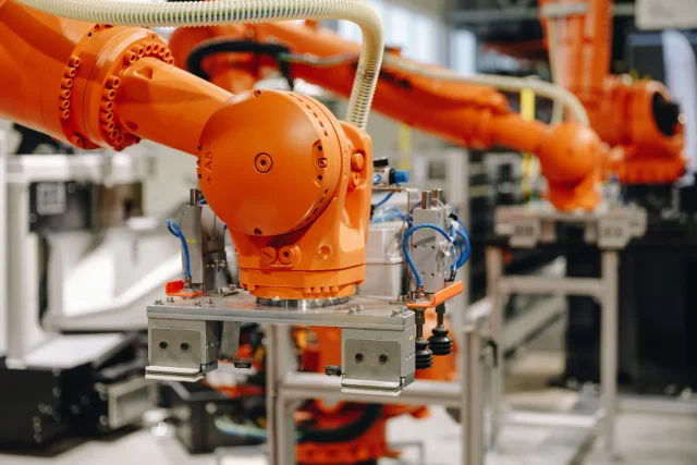 Close-up of an industrial robot gripper on the automated production line.