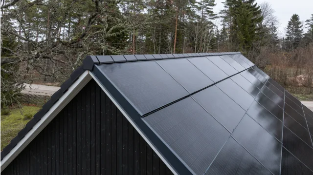 Solar Full Roof™ with integrated solar panels and flat black roof tiles