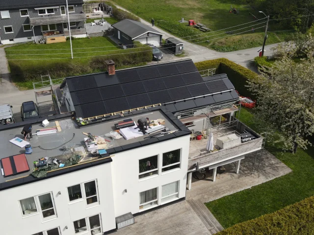 Aerial view of a large building with a completed Solar Full Roof™ installation.
