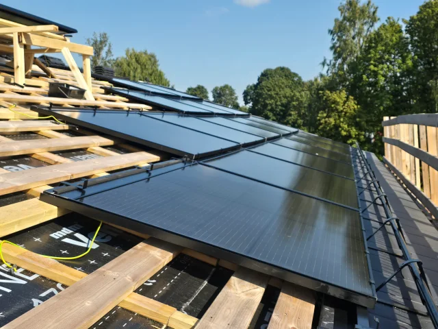 Rows of Solar Full Roof™ modules installed across timber roof battens.