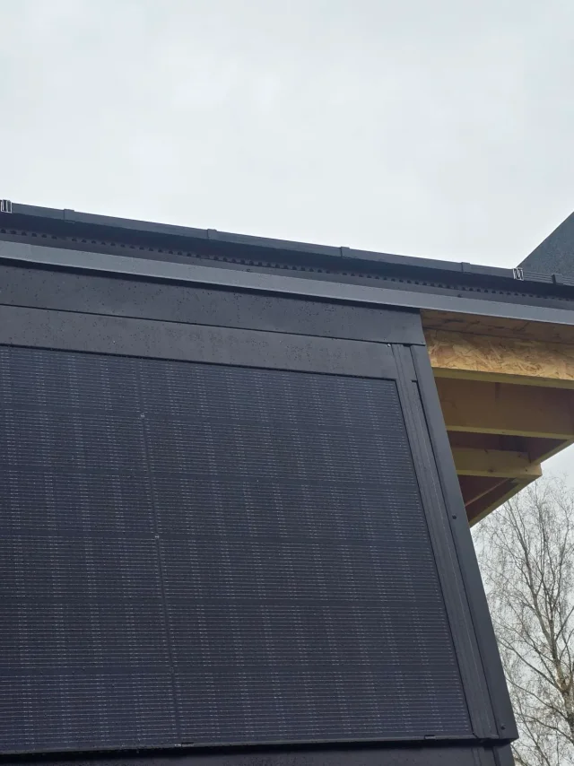 Solar Full Roof™ modules integrated into the steep black surface of a modern building.