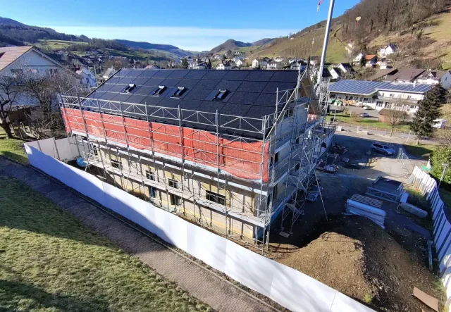 Integrated solar roof installation on a residential building in Switzerland.
