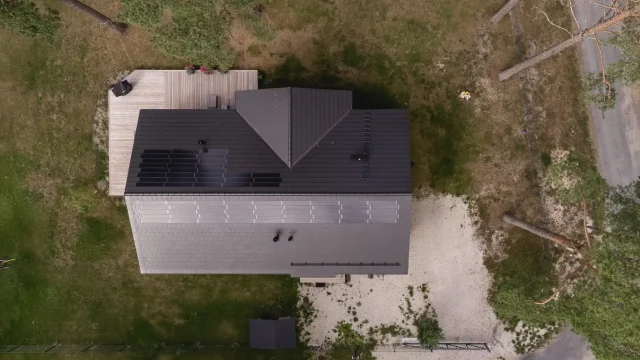 Overhead aerial view of a private home with a custom-pattern Solar Tiled Roof™ installation.