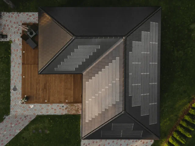Top-down aerial view of a private home with a patterned Solar Tiled Roof™ installation.