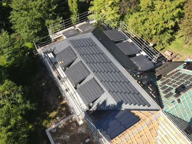 Top-down aerial view of a large Solar Tiled Roof™ installation in progress.