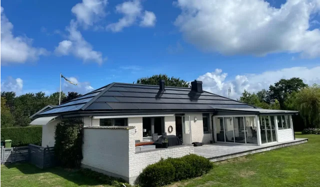 White home with a full integrated solar roof in Jonstorp, Sweden.